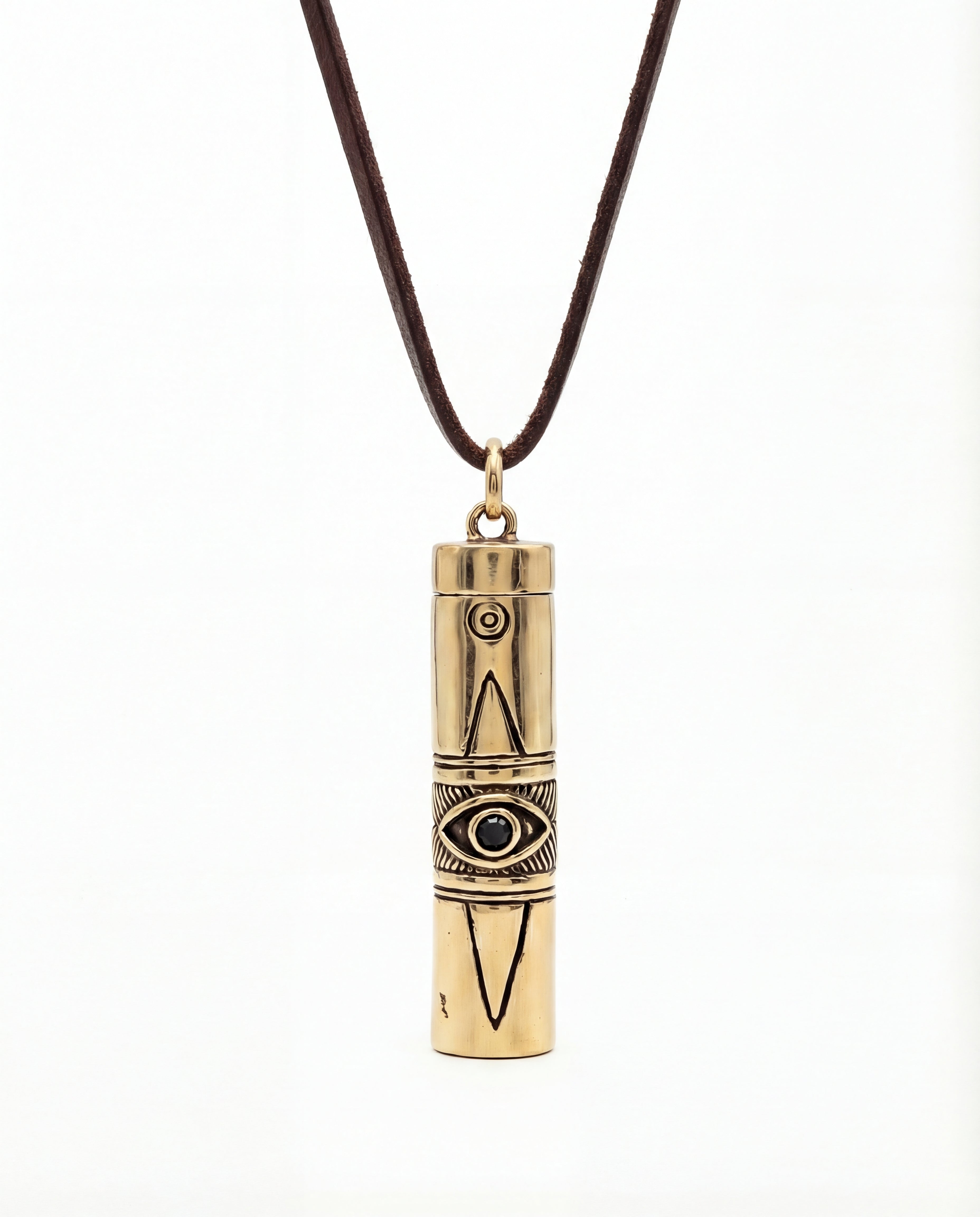 Gold cylindrical pendant with eye design on a brown cord against a white background